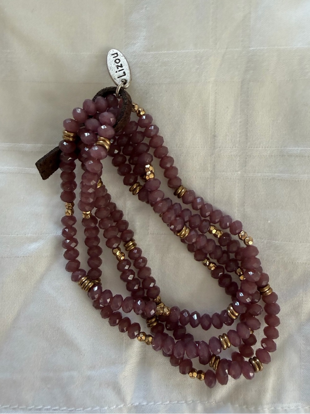 Multi-Strand Mauve Beaded Bracelet with Gold Accents